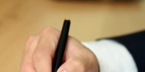 Businessman filing out a form